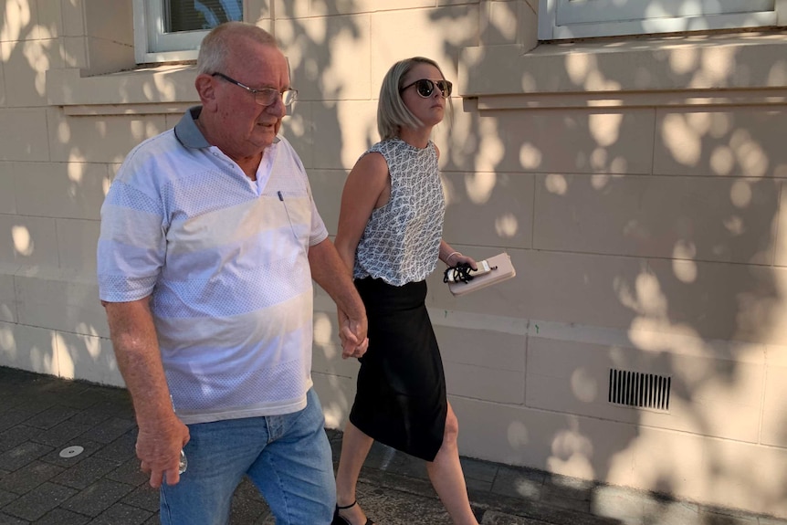 Keith Woodford walks on the street outside the South Australian Coroner's Court.