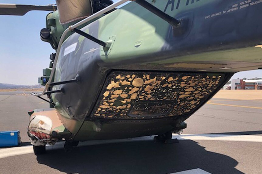 Damage to the underside of Defence chopper caused by fire it accidentally started with a landing light.