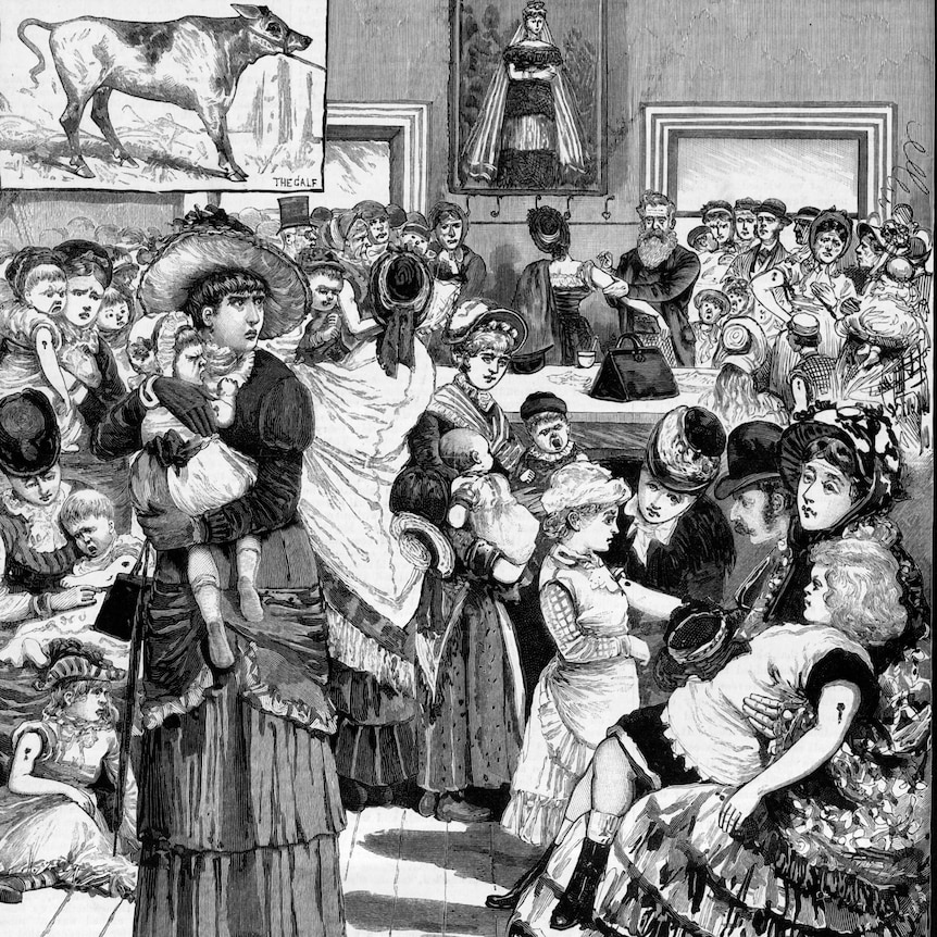 A drawn print of a crowded vaccination clinic in the 19th century.