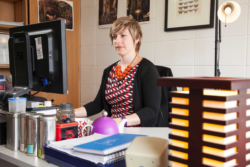 Criminologist Dr Claire Spivakovsky works on a computer.