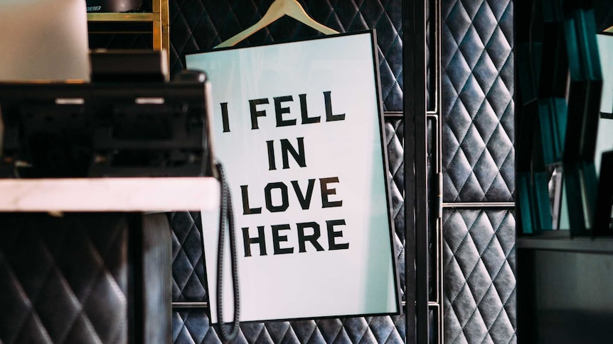A sign in a story reading "I fell in love here"