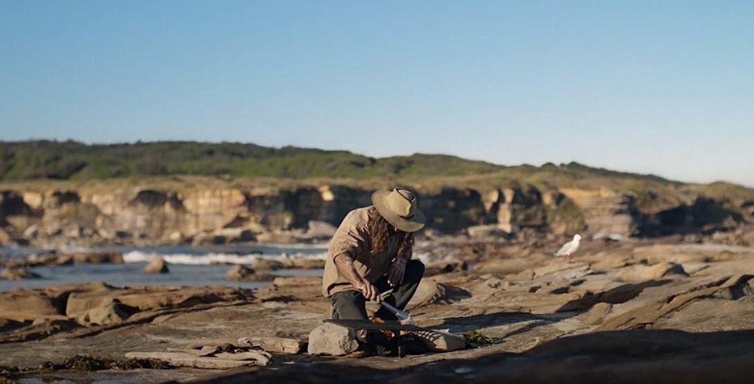 man cooking outdoors 