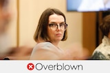 Liberal Senator Anne Ruston wears glasses. Verdict: "overblown" with a red cross