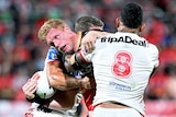 A man is tackled during a rugby league match