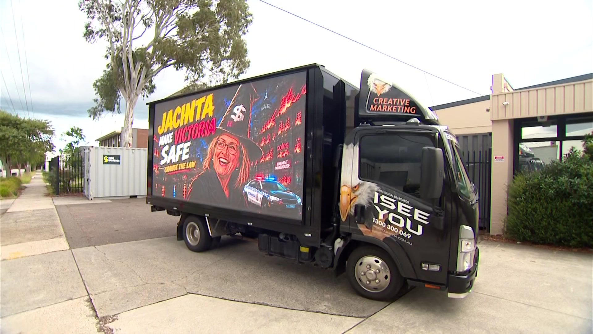 A truck with a mobile billboard on it