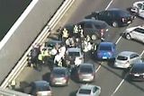 Aerial view of police stopping driver on West Gate Freeway