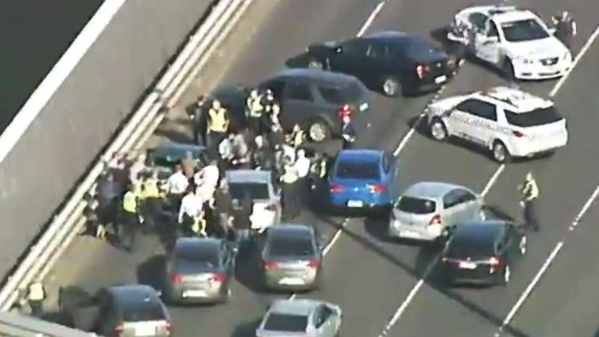 Aerial view of police stopping driver on West Gate Freeway