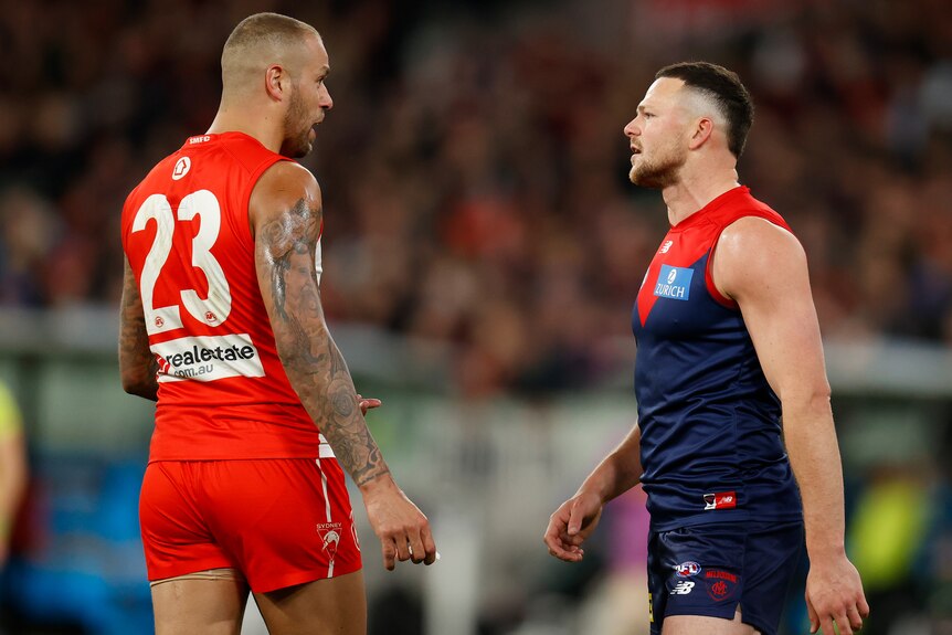 Lance Franklin and Steven May face off