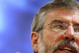 Sinn Fein president Gerry Adams speaks at a podium