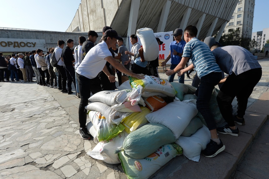 Volunteers collect items to send in support of people left homeless during the fighting.