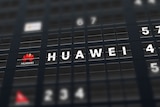 A mock airport departure sign with Huawei written on it.