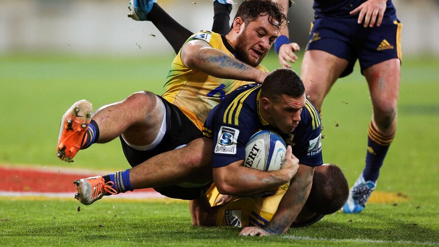 Shaun Treeby is tackled for the Highlanders