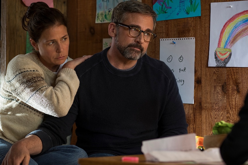 Colour photo of Steve Carell and Maura Tierney sitting closely in 2018 film Beautiful Boy.