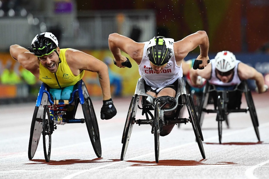 Canada's Alexander Dupont (R) and Australia's Kurt Fearnley cross the finish after the T54 1,500m.