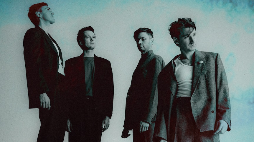 Blue washed image of four men from Glass Animals standing together in coats