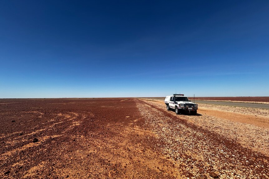 A police vehicle in the outback.