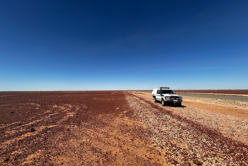 A police vehicle in the outback.