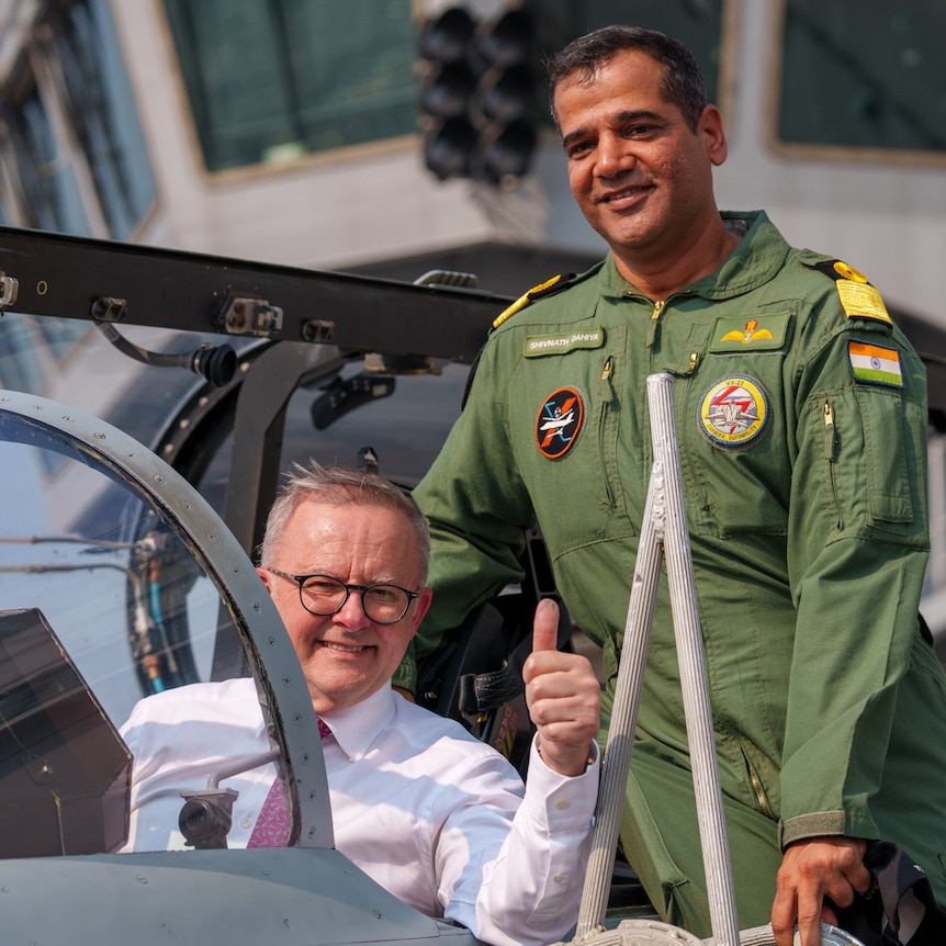 Anthony Albanese gives the thumbs up from the cockpit of a fighter jet