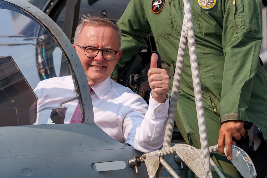 Anthony Albanese gives the thumbs up from the cockpit of a fighter jet