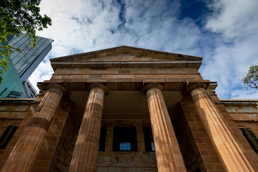 A stone building with large columns