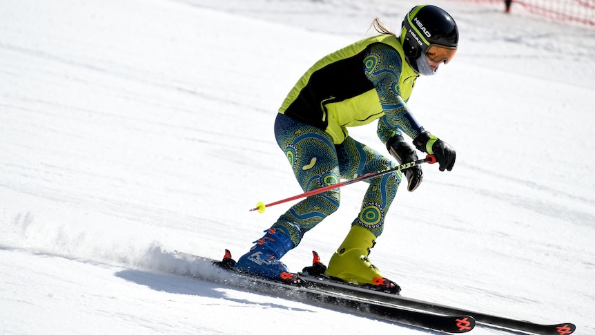 Rae Anderson skiing down a slope