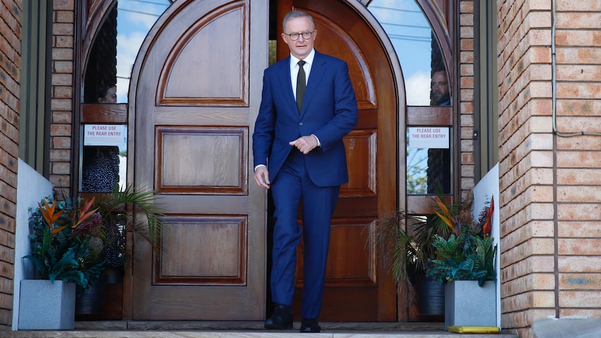 Anthony Albanese walks out of a church after a Good Friday service.