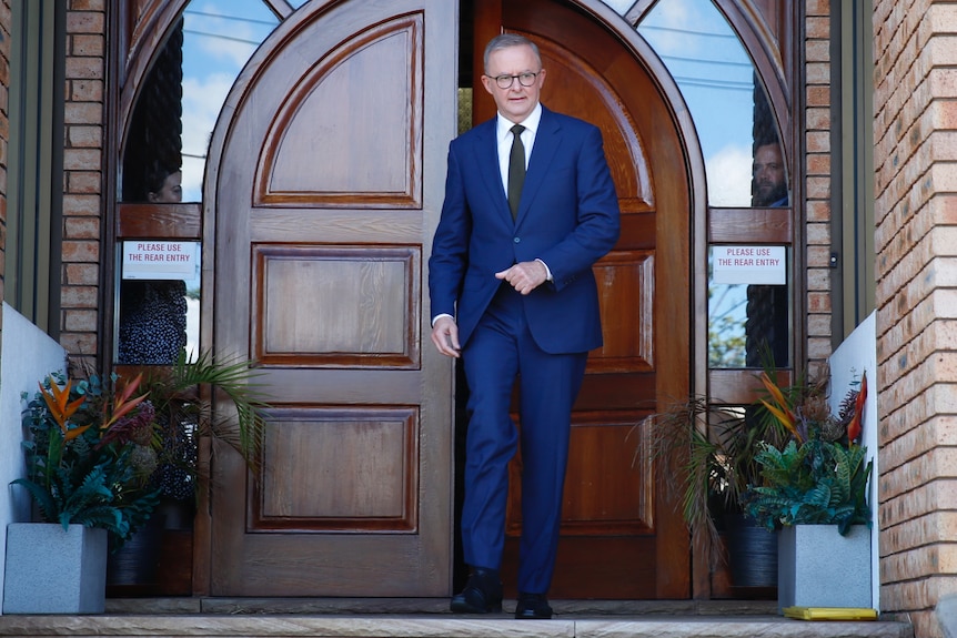 Anthony Albanese walks out of a church after a Good Friday service.