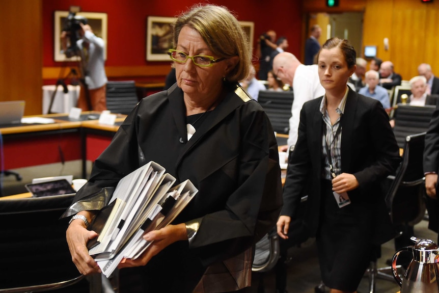 Megan Latham walking out of a hearing at the NSW Parliament.