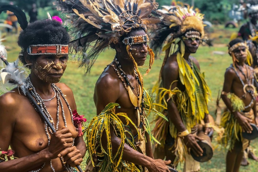 Dancers and villagers from Gorari in Papua New Guinea give visitors a traditional welcome.