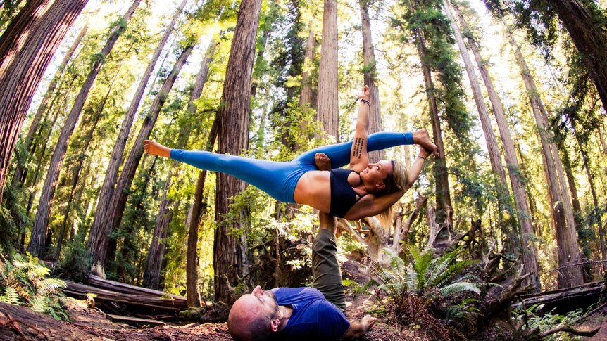 Bonnie Argo doing AcroYoga with a partner