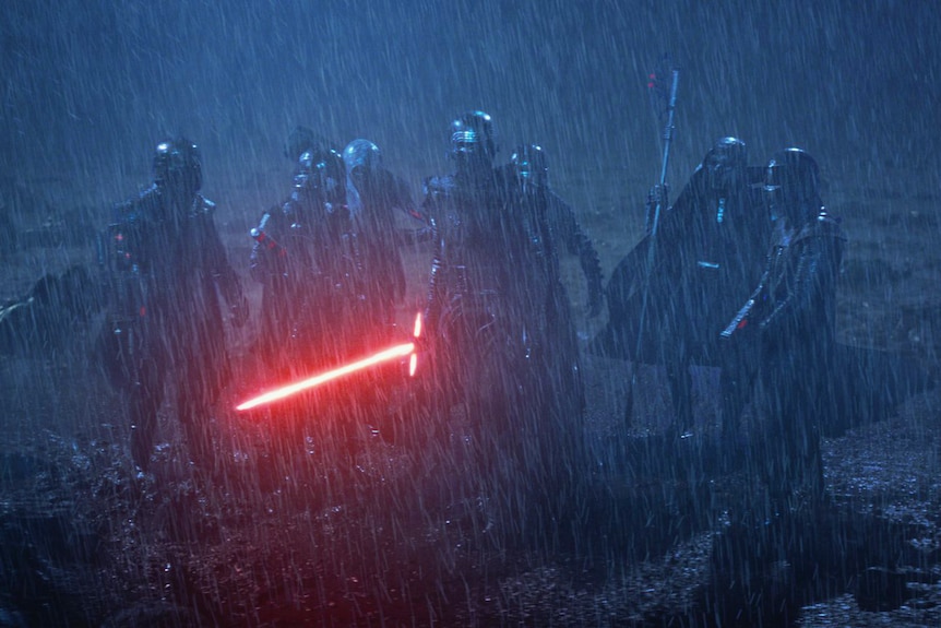 Kylo Ren and six other Knights of Ren face off against Rey in the rain.