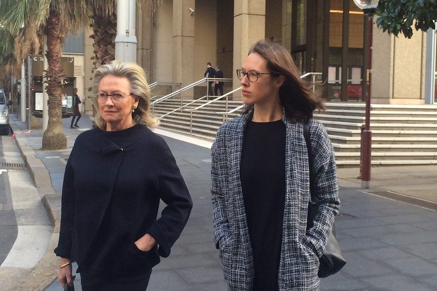 Jill Hickson Wran with another woman walking outside court.