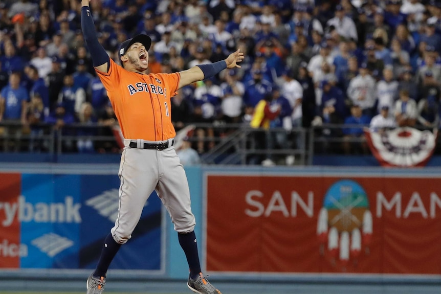 Carlos Correa celebrates winning the World Series