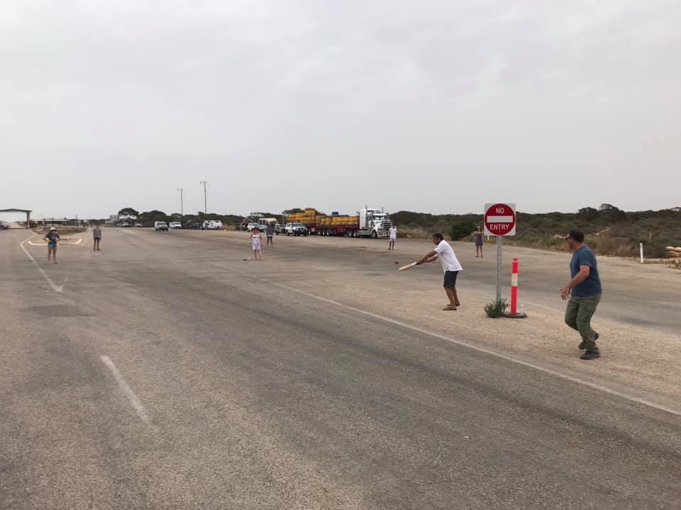 People playing cricket on the Eyre Highway.