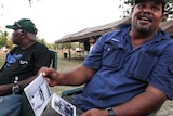 Phil McCarthy, Bardi Jawi ranger, examines historic photos