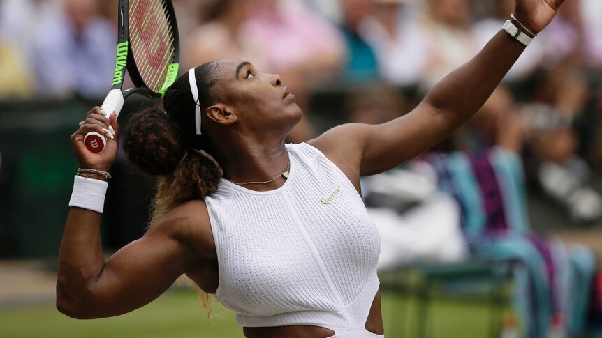 Serena Williams looks skywards mid-serve at Wimbledon