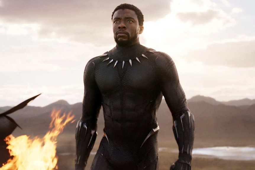 A character in Black Panther looks courageously ahead