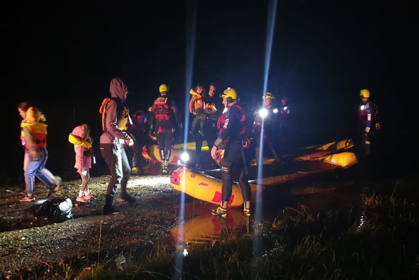 Emergency teams and boats recue residents during the night 