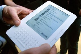 A man holding a Kindle e-reader (AFP: Mario Tama)