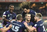 Melbourne Storm celebrate Cheyse Blair's try against Canberra