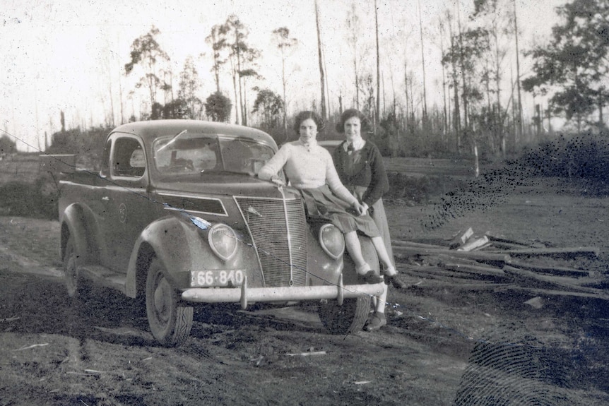 Gwen and Margaret Sims with a Ford ute at a timber mill in Powelltown, in 1939.
