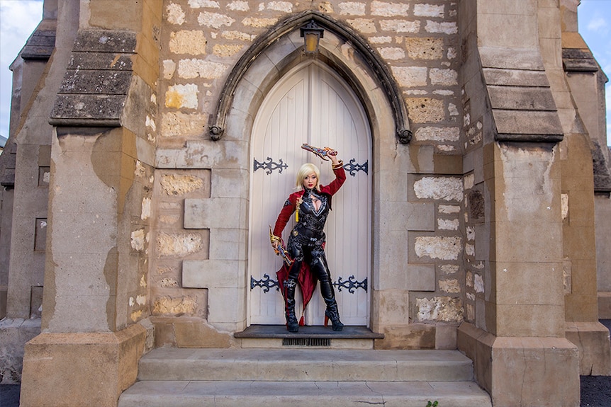 Yaya Han poses in front of a church on North Terrace in Adelaide.