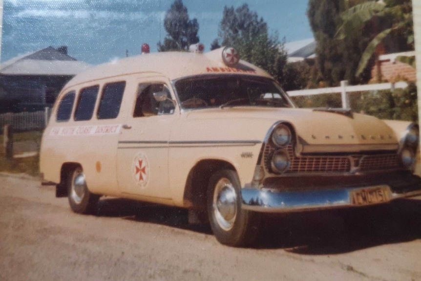 Image of a yellow Chrysler Royal push-button automatic ambulance.
