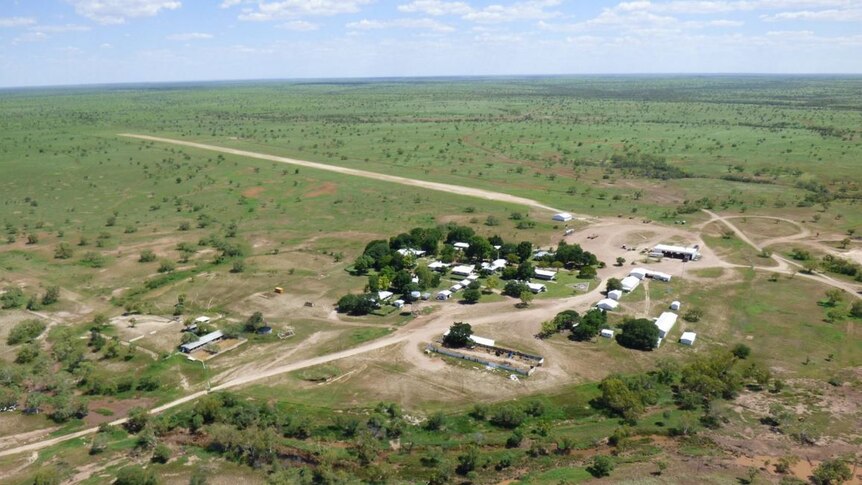 a cattle station homestead and green surrounds, taken from a helicopter