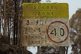 A burnt-out school zone sign at Mogo in the south-east of NSW
