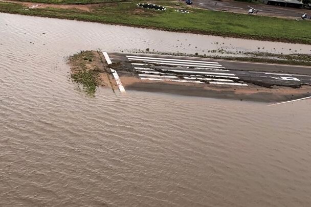 Water lying on the runway of Fitzroy Crossing airport runway.