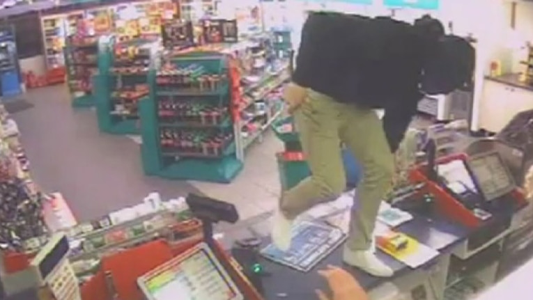 CCTV: Coulter used a tyre iron to threaten and attack an attendant at the Caltex service station in Kaleen.