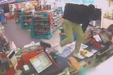 CCTV: Coulter used a tyre iron to threaten and attack an attendant at the Caltex service station in Kaleen.