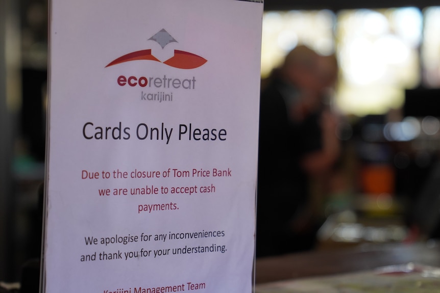 A placard sign reading "Cards Only Please" on a bar