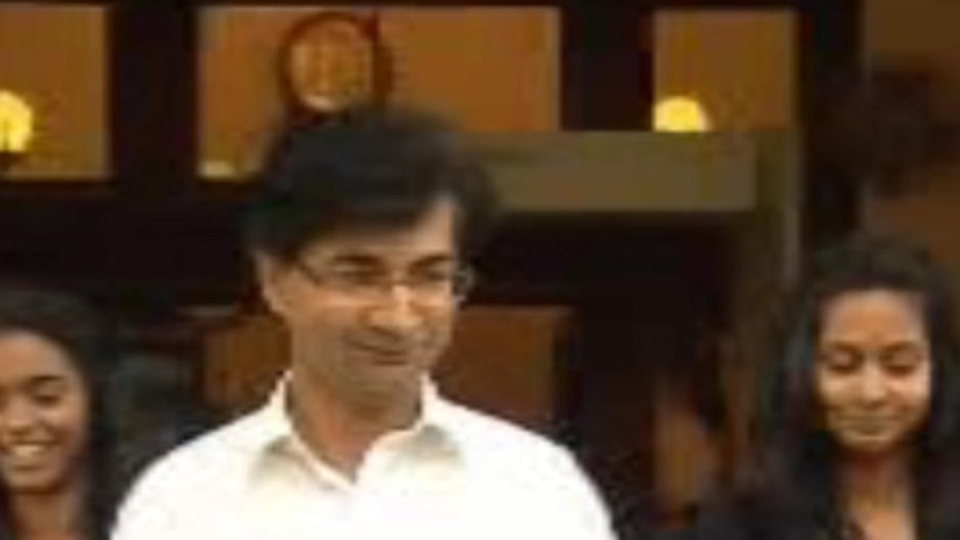 Lloyd Rayney flanked by his daughters